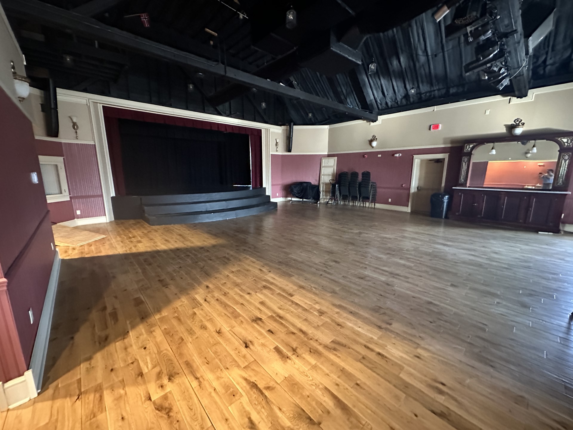 The Maddock Opera House is on the second floor and has a stage for performances and an open wood floor for seating
