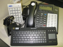 AT equipment for hands-free phone use, computer access and paper manipulation
