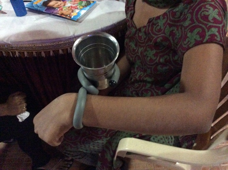 Cup with twist tie wrapped around it so it is easier to hold