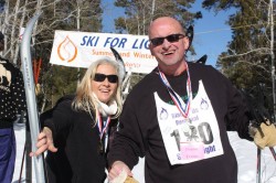 Photo of Beth and Donnie at the Race Day Finishing line at Black Hills Ski for Light. 