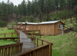 A photo of Meeting the Need Resort, showing the long accessible ramp for wheelchair users.