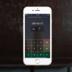 Picture of the app on a phone screen displaying a math problem the use has to solve in order to turn the alarm off