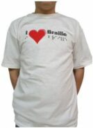 Photo of white t-shirt with "I love Braille" in black Braille and also printed "I (heart) Braille"