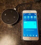 Picture of an Echo Dot and Amazon Application on an iPhone