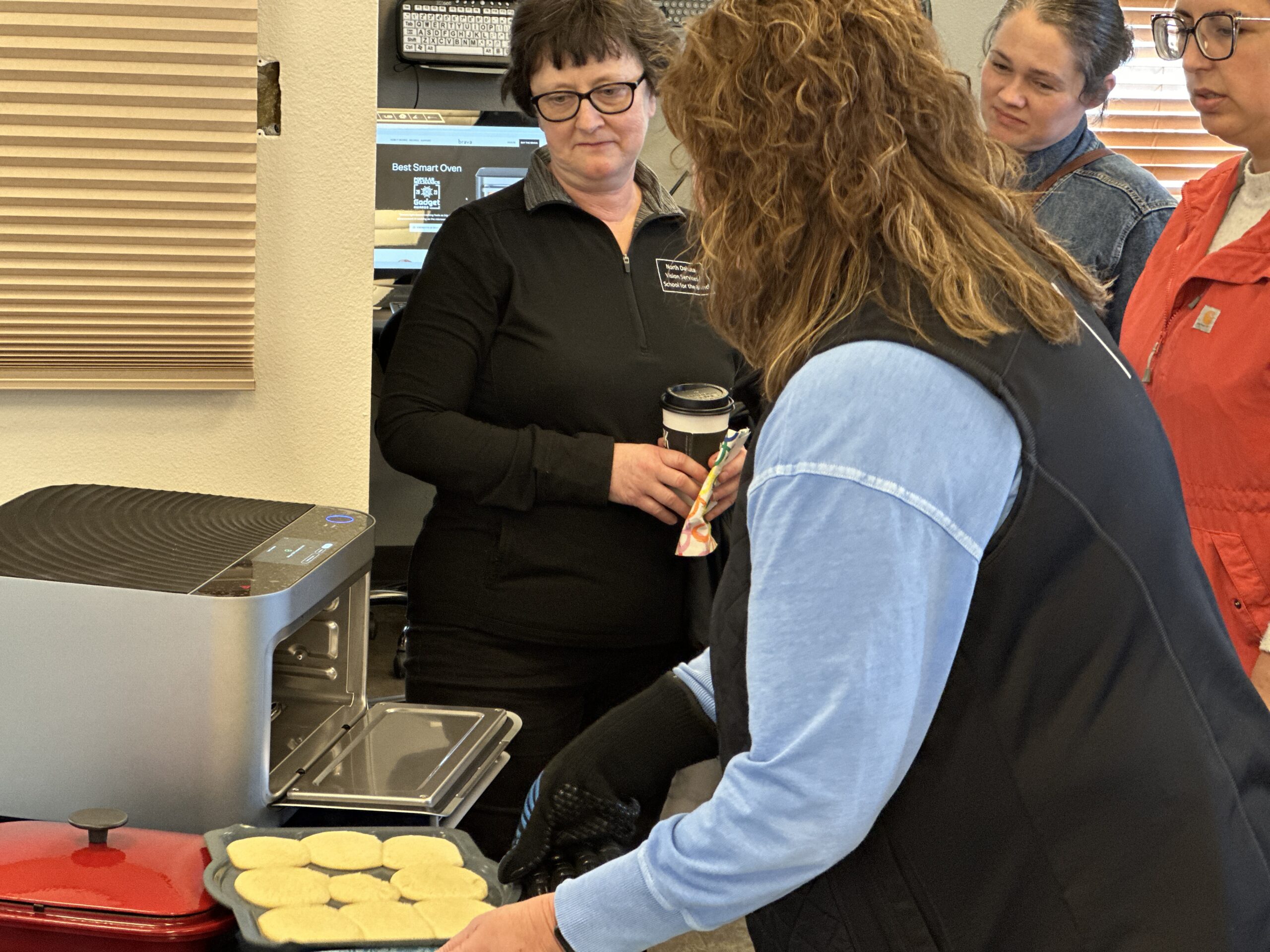 AT Technician Krista Burman demonstrates a Brava smart oven by baking cookies at our open house.