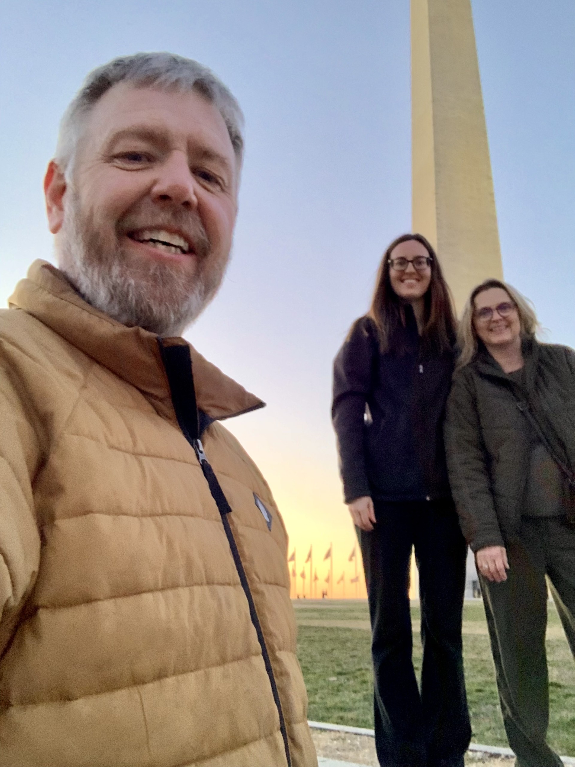 Mike Chaussee, Alexis Witt, and Nancy Nikolas-Maier stand in front of the Washington Monument in Washington, D.C.