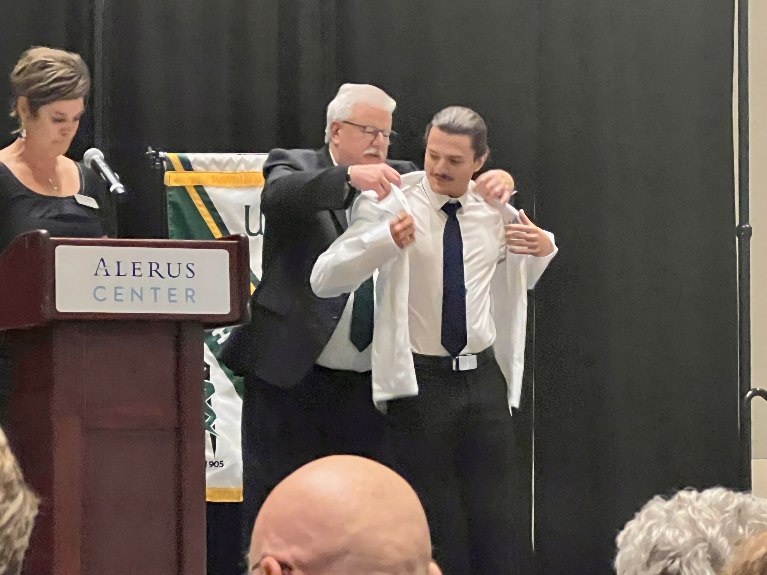 Paxton Franke receiving his white coat during a ceremony at UND.