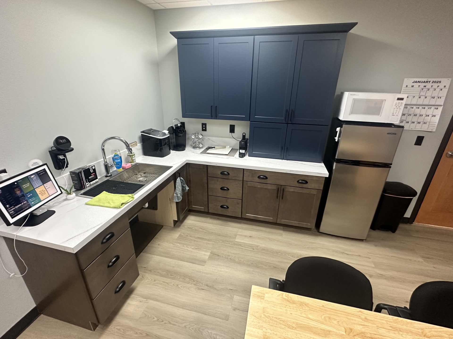 Bismarck's new accessible kitchen showing smart faucet and cabinets.